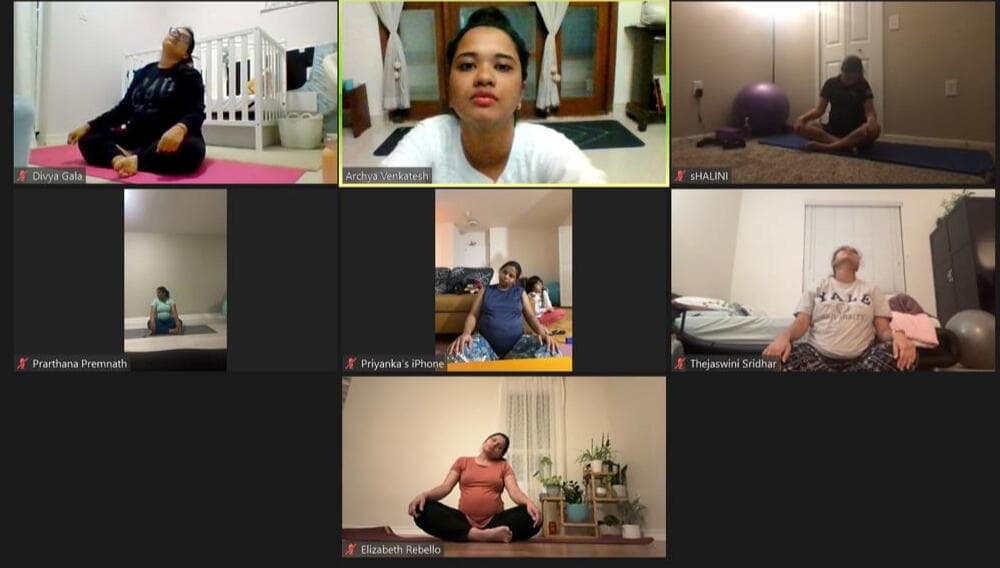 Group prenatal yoga session with Archya guiding expectant mothers